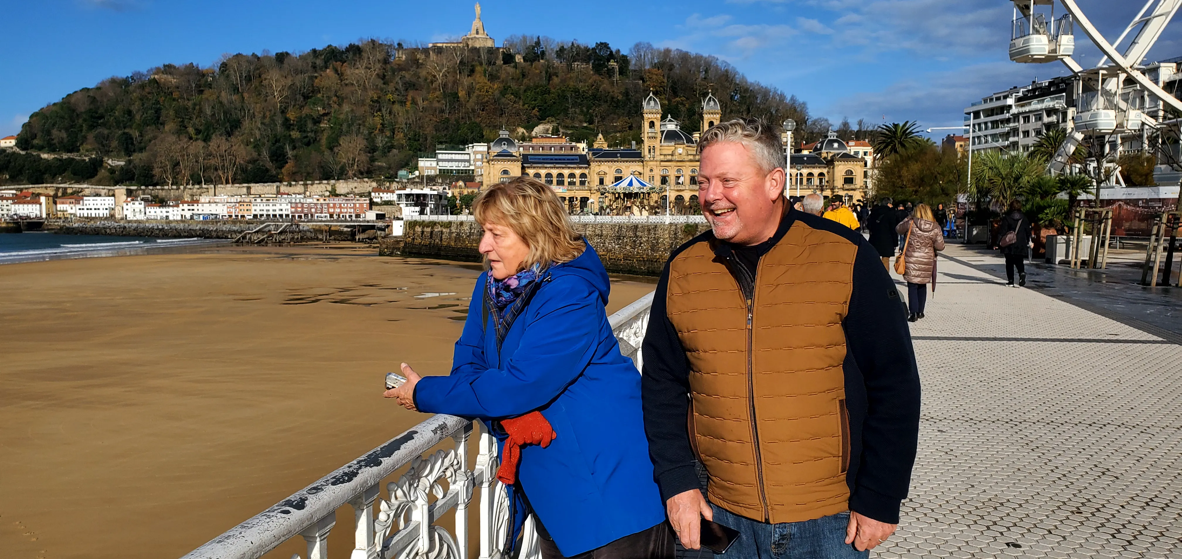 John on the San Sebastián seafront, with Mount Urgull and the city hall behind